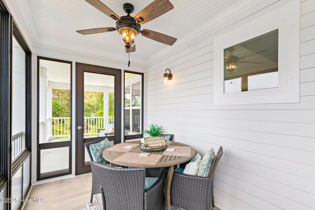 104 SE 32nd St, Oak Island, NC 28465 - sunroom / solarium featuring a ceiling fan and outdoor dining space