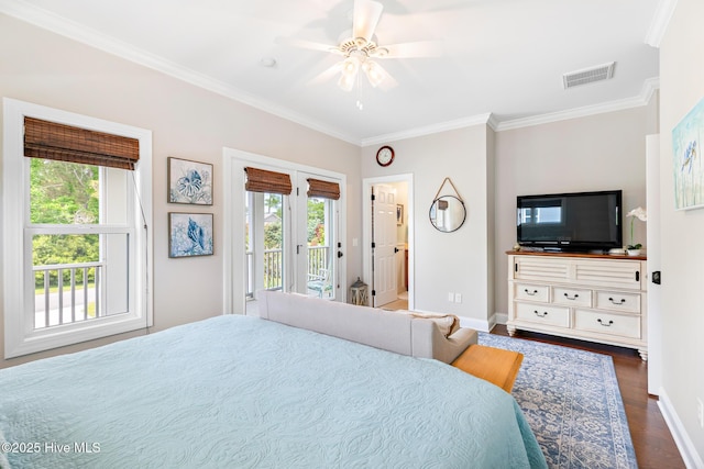 104 SE 32nd St, Oak Island, NC 28465 - bedroom with access to exterior, multiple windows, ornamental molding, baseboards, and dark wood-style floors
