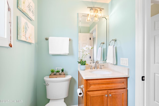 104 SE 32nd St, Oak Island, NC 28465 - bathroom featuring toilet, vanity, and a chandelier