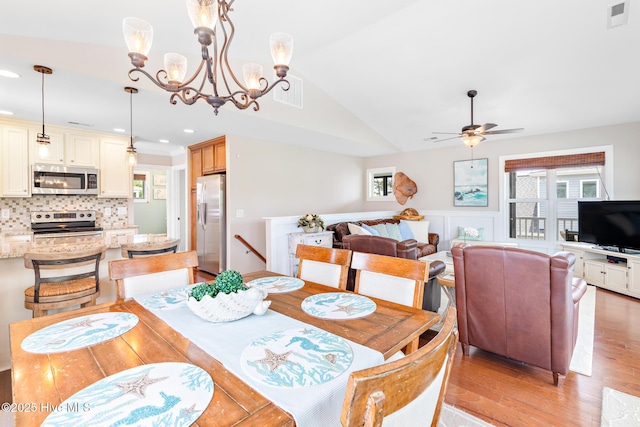 104 SE 32nd St, Oak Island, NC 28465 - dining space featuring light wood finished floors, ceiling fan, lofted ceiling, and recessed lighting