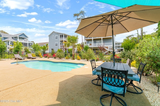 104 SE 32nd St, Oak Island, NC 28465 - view of pool featuring a patio area, fence, a residential view, and outdoor dining space