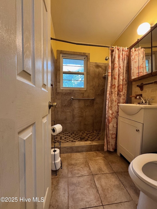 6748 Pitt St, Grifton, NC 28530 - full bath featuring tiled shower, vanity, toilet, and tile patterned flooring