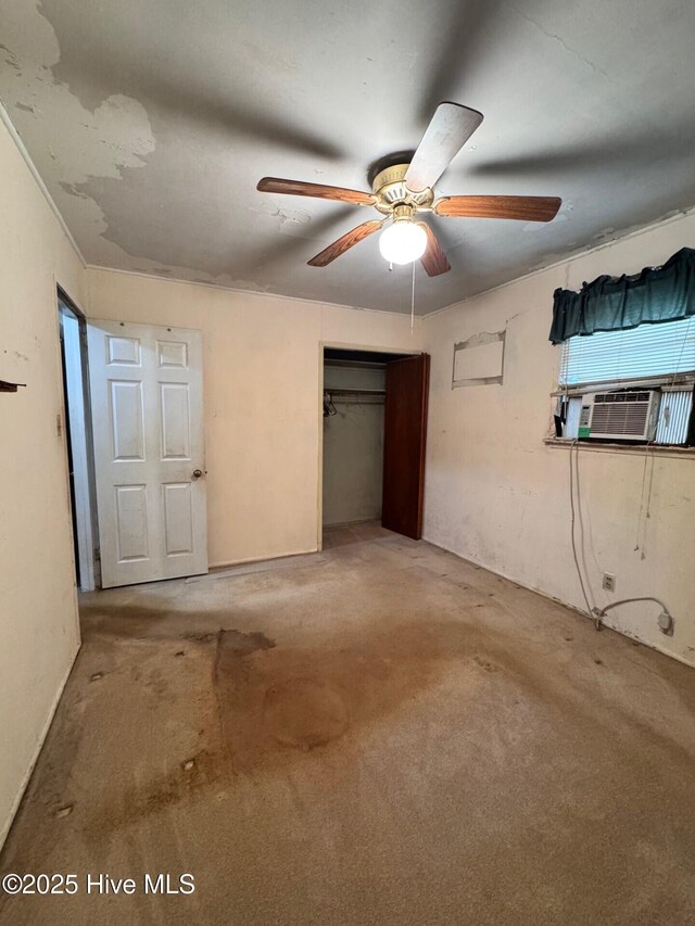 6748 Pitt St, Grifton, NC 28530 - unfurnished bedroom with carpet, a closet, cooling unit, and a ceiling fan