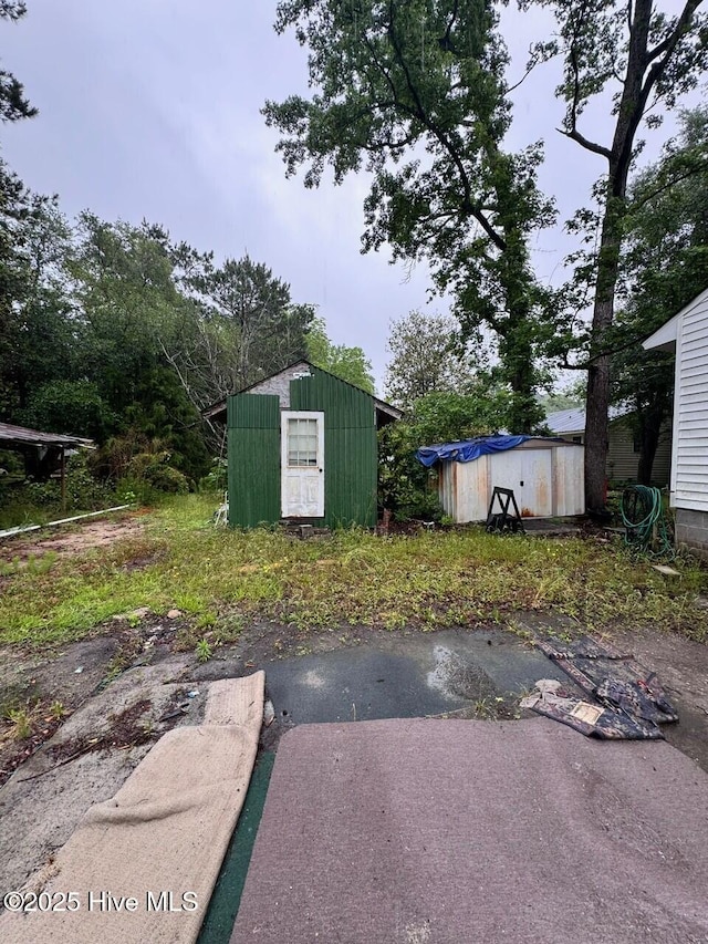 6748 Pitt St, Grifton, NC 28530 - view of yard featuring a shed and an outbuilding