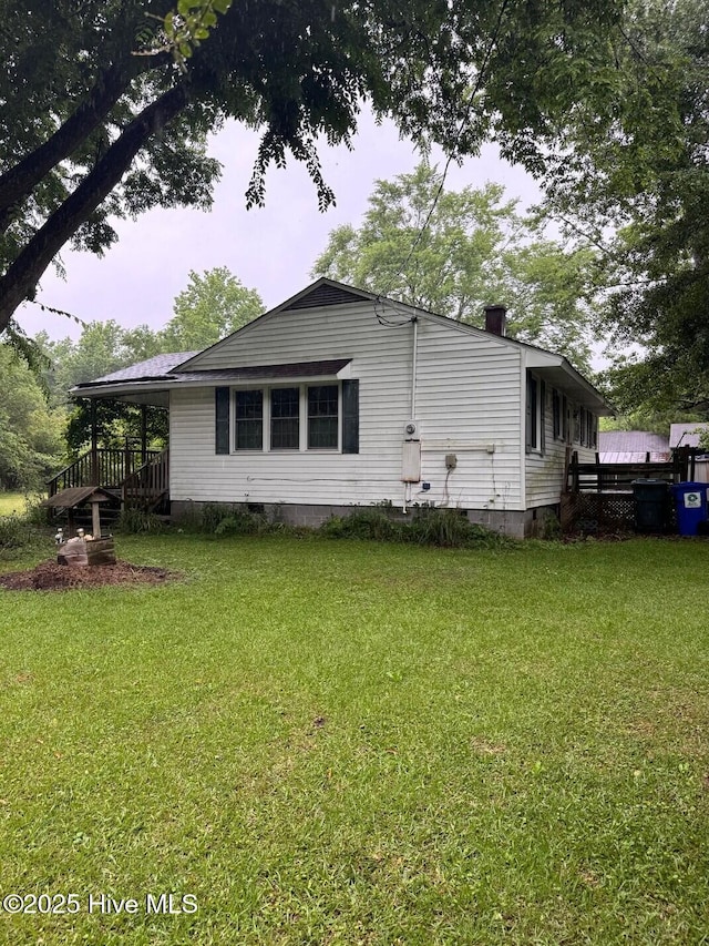6748 Pitt St, Grifton, NC 28530 - back of house with crawl space and a yard