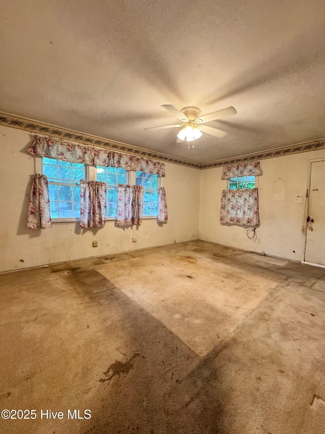 6748 Pitt St, Grifton, NC 28530 - carpeted spare room with a textured ceiling and ceiling fan