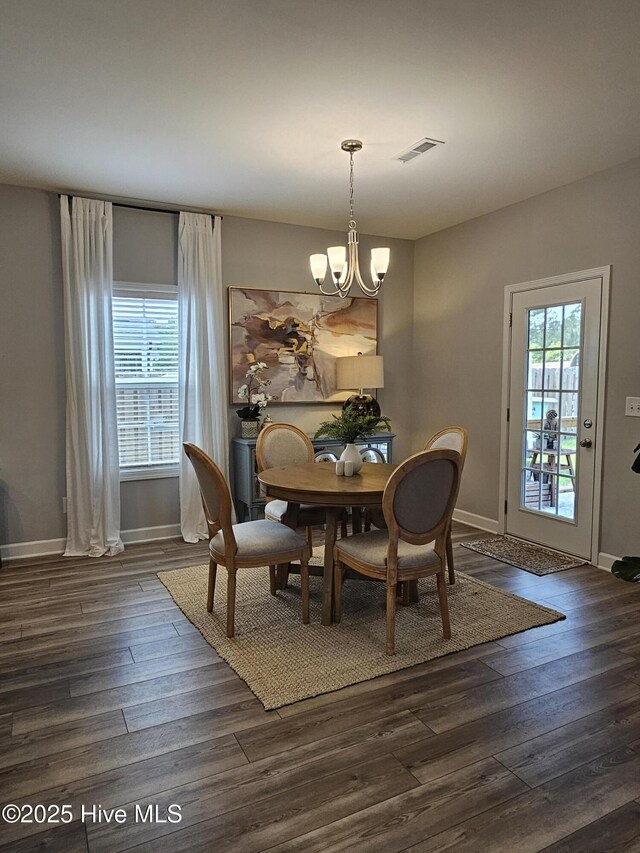 568 Transom Way, Sneads Ferry, NC 28460 - dining area featuring a chandelier, baseboards, and dark wood finished floors