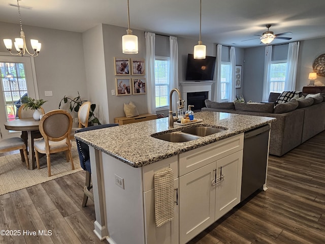 568 Transom Way, Sneads Ferry, NC 28460 - kitchen with dishwashing machine, a sink, open floor plan, dark wood finished floors, and a fireplace