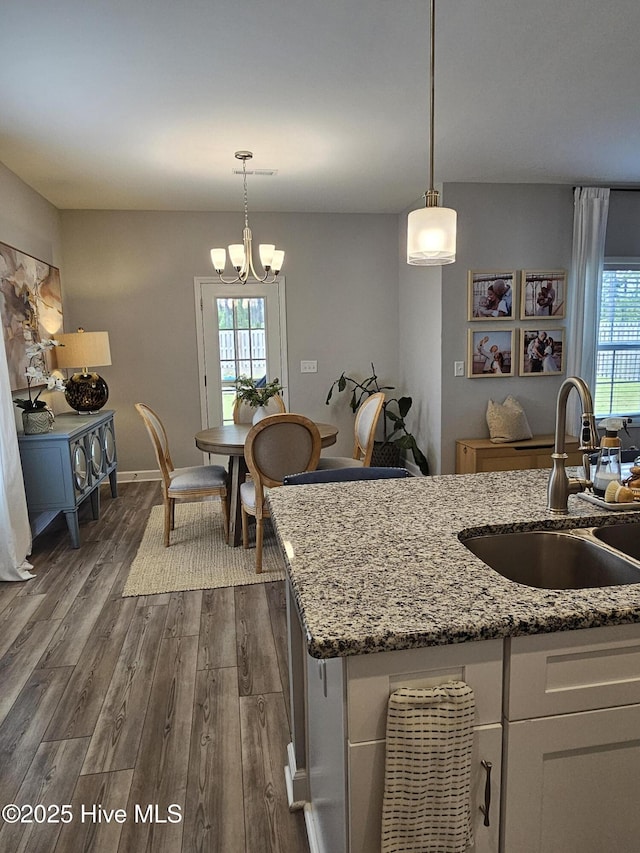 568 Transom Way, Sneads Ferry, NC 28460 - kitchen with a sink, dark wood-style floors, healthy amount of natural light, and a chandelier