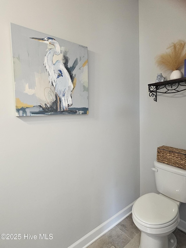 568 Transom Way, Sneads Ferry, NC 28460 - bathroom with baseboards, toilet, and tile patterned flooring