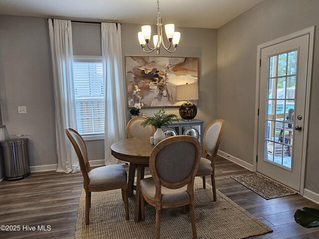 568 Transom Way, Sneads Ferry, NC 28460 - dining area featuring a chandelier, wood finished floors, and baseboards