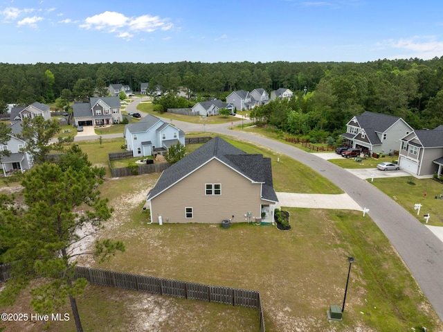 aerial perspective of suburban area featuring a forest
