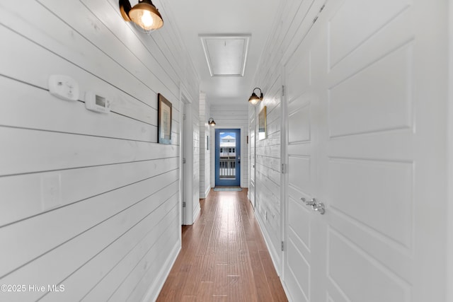 2304 W Dolphin Dr, Oak Island, NC 28465 - hall featuring hardwood / wood-style flooring and attic access