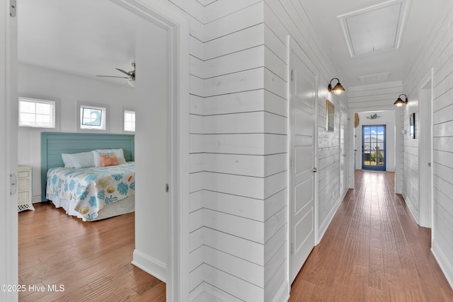2304 W Dolphin Dr, Oak Island, NC 28465 - hallway featuring wood finished floors and healthy amount of natural light