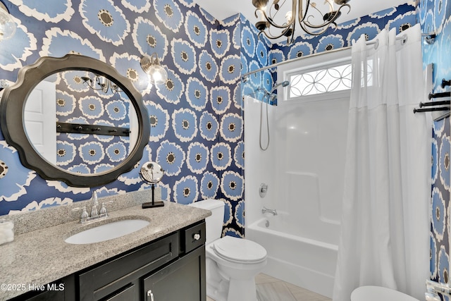 2304 W Dolphin Dr, Oak Island, NC 28465 - full bath featuring wallpapered walls, toilet, a chandelier, shower / tub combo, and vanity