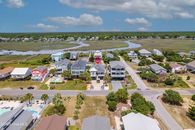 2304 W Dolphin Dr, Oak Island, NC 28465 - aerial view of residential area with a large body of water and a pool