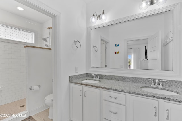 2304 W Dolphin Dr, Oak Island, NC 28465 - full bath with a tile shower, plenty of natural light, and toilet