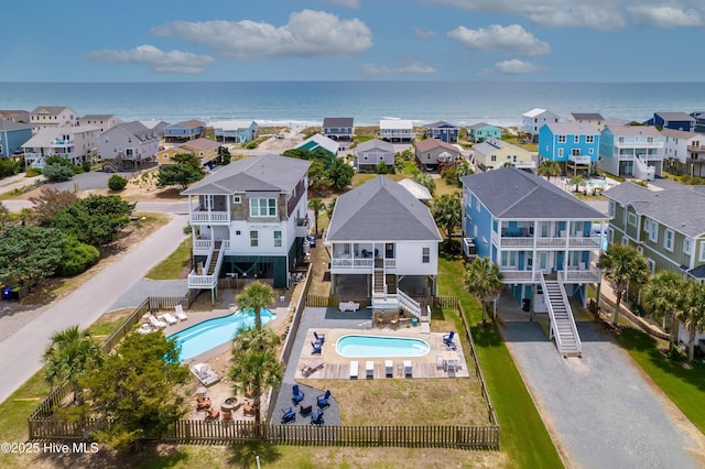 2304 W Dolphin Dr, Oak Island, NC 28465 - aerial view of residential area featuring a pool and a large body of water