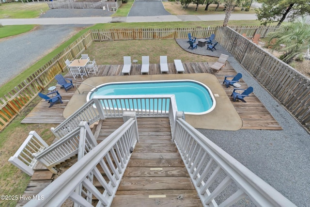 2304 W Dolphin Dr, Oak Island, NC 28465 - view of pool with a deck and a fenced backyard