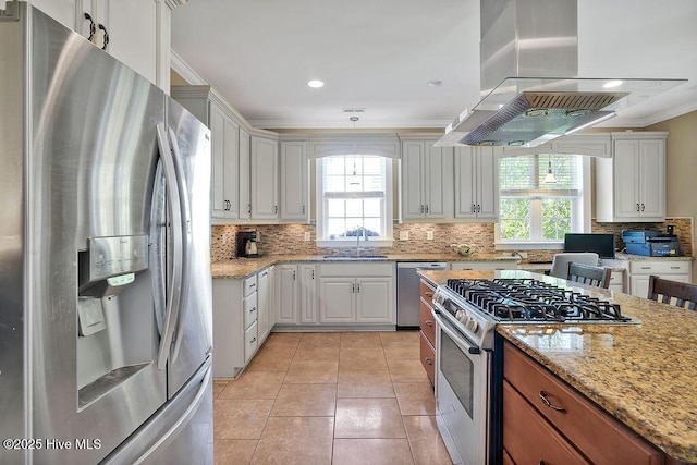 886 Hollybriar Dr SE, Bolivia, NC 28422 - kitchen with stainless steel appliances, a sink, plenty of natural light, ornamental molding, and tasteful backsplash