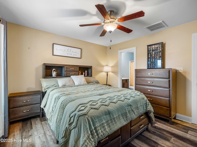 bedroom with wood finished floors, baseboards, and a ceiling fan