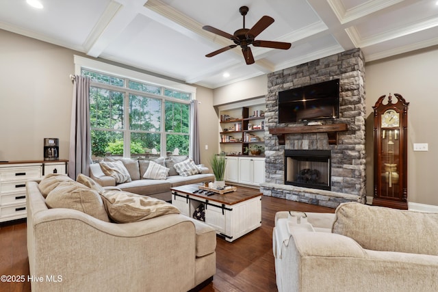 living area with coffered ceiling, ornamental molding, ceiling fan, beamed ceiling, and dark wood-type flooring