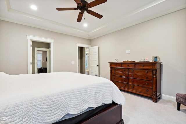 bedroom featuring a tray ceiling, light carpet, recessed lighting, ornamental molding, and ceiling fan