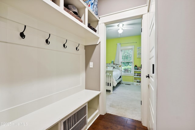 mudroom featuring ceiling fan, dark wood finished floors, and baseboards