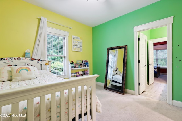bedroom with carpet and baseboards