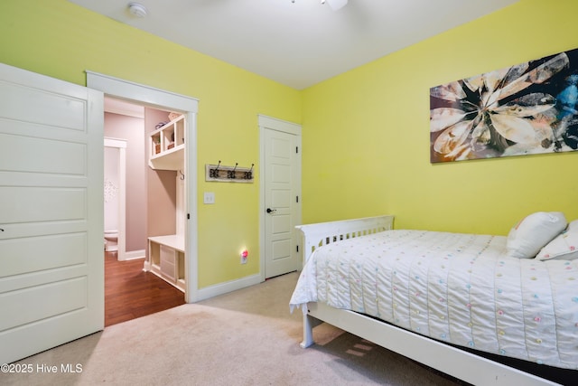 carpeted bedroom with baseboards