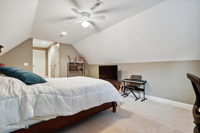bedroom with vaulted ceiling, carpet floors, baseboards, and ceiling fan