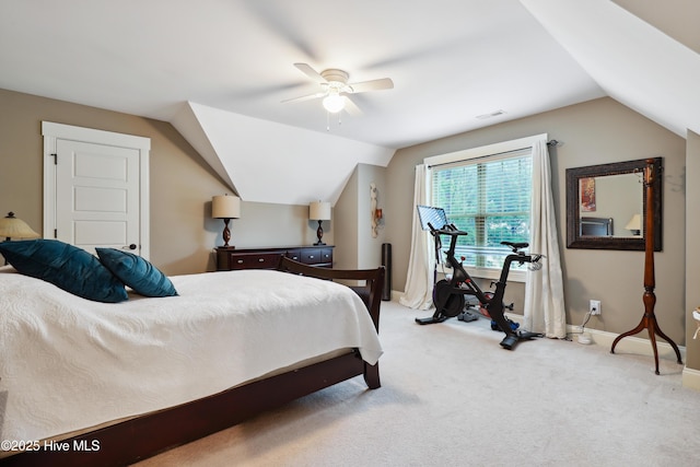 carpeted bedroom featuring lofted ceiling, baseboards, and a ceiling fan
