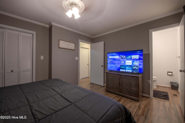2518 Pilot-Riley Rd, Zebulon, NC 27597 - bedroom featuring wood finished floors, crown molding, a closet, ensuite bathroom, and baseboards