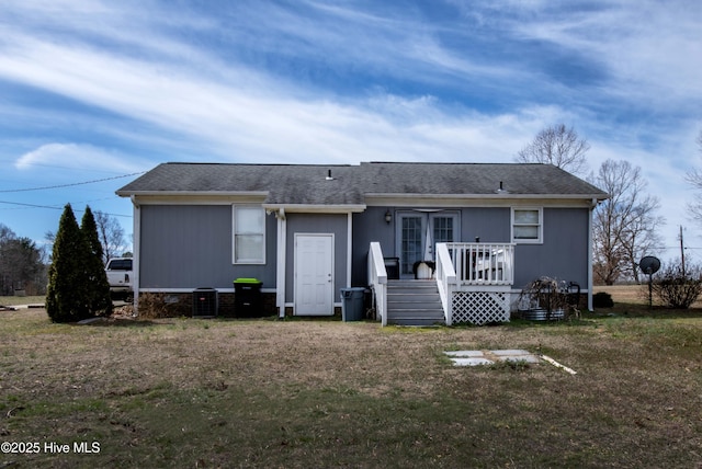 2518 Pilot-Riley Rd, Zebulon, NC 27597 - rear view of house featuring a wooden deck, a lawn, and roof with shingles
