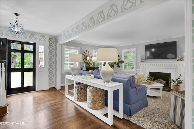 1218 Country Club Rd, Wilmington, NC 28403 - entryway with ornamental molding, baseboards, healthy amount of natural light, a brick fireplace, and wood finished floors