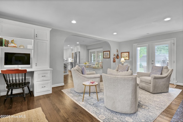 1218 Country Club Rd, Wilmington, NC 28403 - living room with arched walkways, ornamental molding, dark wood-style flooring, recessed lighting, and baseboards