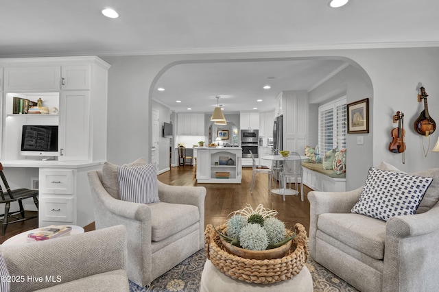 1218 Country Club Rd, Wilmington, NC 28403 - living room featuring arched walkways, dark wood-style floors, crown molding, and recessed lighting