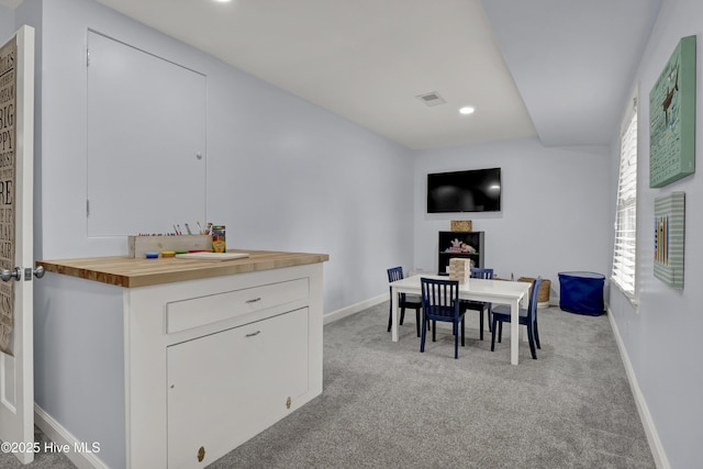 1218 Country Club Rd, Wilmington, NC 28403 - dining room with light colored carpet, baseboards, and recessed lighting