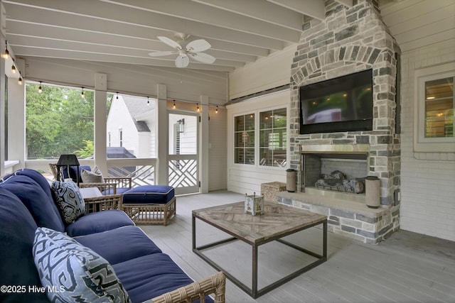 1218 Country Club Rd, Wilmington, NC 28403 - living room with wood finished floors, a ceiling fan, beamed ceiling, and an outdoor stone fireplace