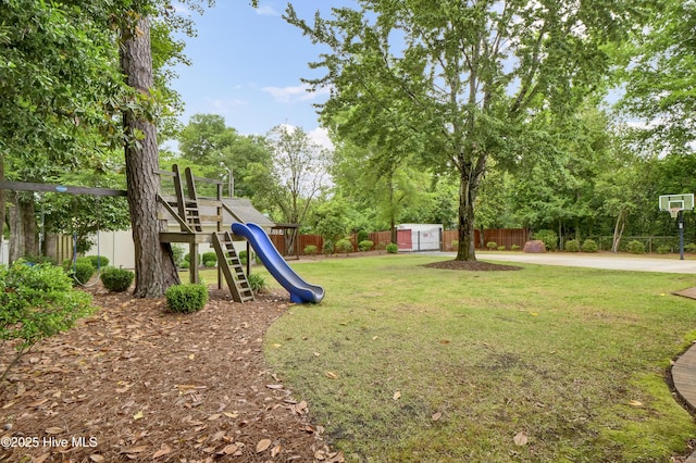 1218 Country Club Rd, Wilmington, NC 28403 - view of yard with a playground, a storage shed, view of wooded area, and an outdoor structure