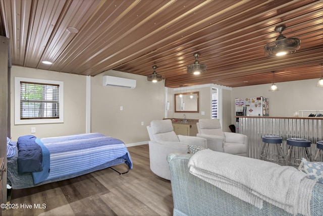 1218 Country Club Rd, Wilmington, NC 28403 - bedroom with a dry bar, a wall unit AC, wood finished floors, and baseboards
