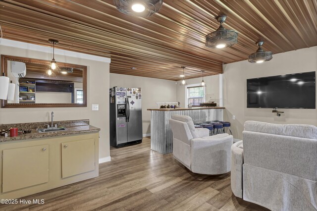 1218 Country Club Rd, Wilmington, NC 28403 - living room featuring wood ceiling, light wood-style floors, and baseboards