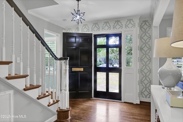 1218 Country Club Rd, Wilmington, NC 28403 - foyer entrance with ornamental molding, stairs, wood finished floors, and healthy amount of natural light