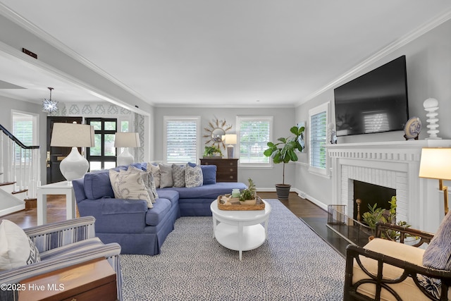 1218 Country Club Rd, Wilmington, NC 28403 - living room with stairway, wood finished floors, baseboards, crown molding, and a brick fireplace