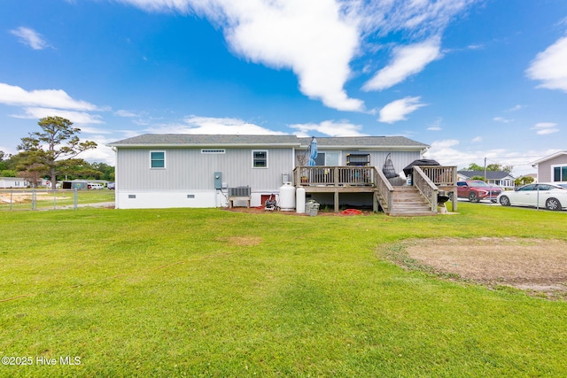 rear view of house with crawl space, a wooden deck, and central air condition unit