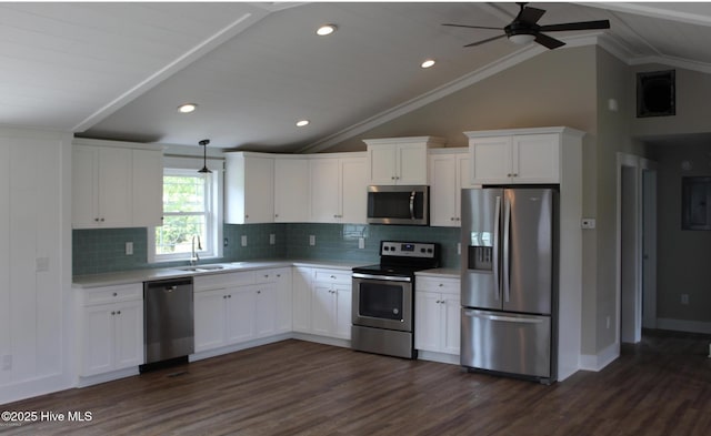kitchen with appliances with stainless steel finishes, light countertops, white cabinetry, dark wood-style floors, and a ceiling fan
