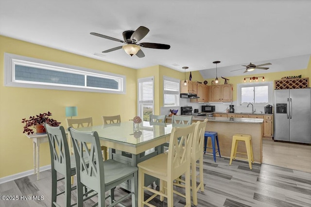 167 Topsail Rd, North Topsail Beach, NC 28460 - dining space with a ceiling fan and light wood-style floors