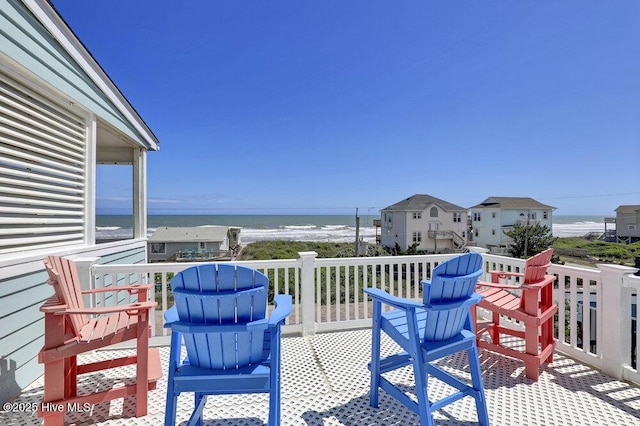 wooden deck featuring a water view