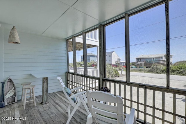 sunroom / solarium with a residential view