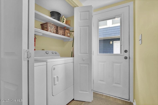 167 Topsail Rd, North Topsail Beach, NC 28460 - washroom with washing machine and clothes dryer and light wood-type flooring